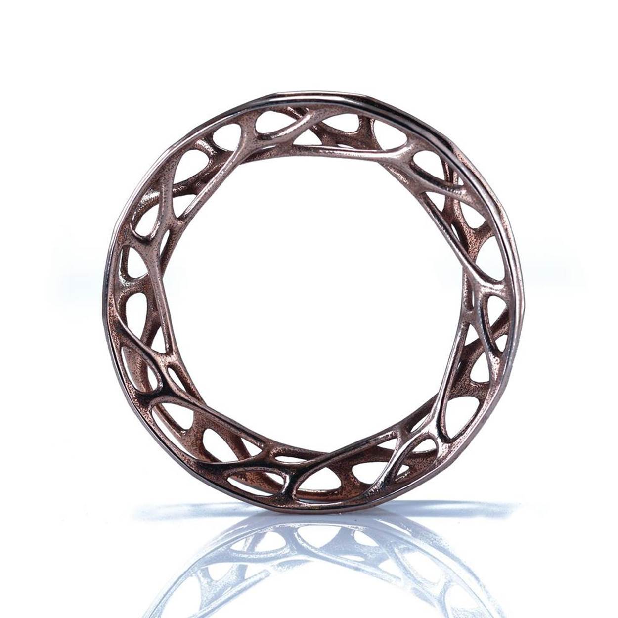 Nervous System&rsquo;s &ldquo;Convolution&rdquo; bangle, stainless steel, based on simulated forces in a cellular network.