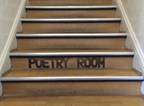 The wooden stairs in the famous City Lights Bookstore in San Francisco, this time showing a labelPhoto by author.