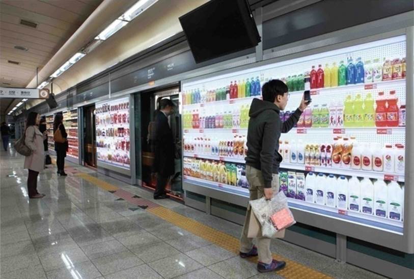 Shoppers scan simulated products for home delivery, while waiting for the subwayImages from Flock promotional video for work done with Tesco/Home Plus ().